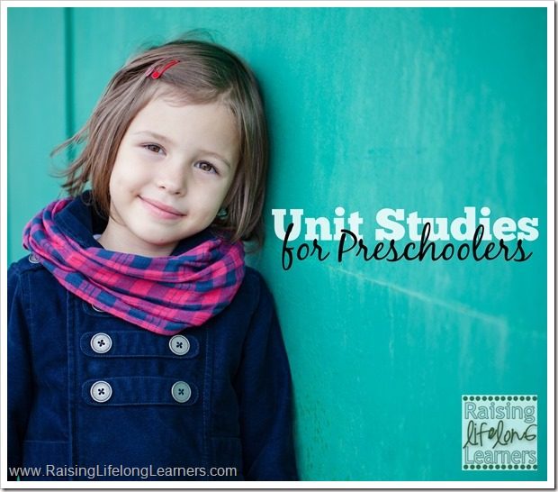 Portrait of preschooler girl near green wall