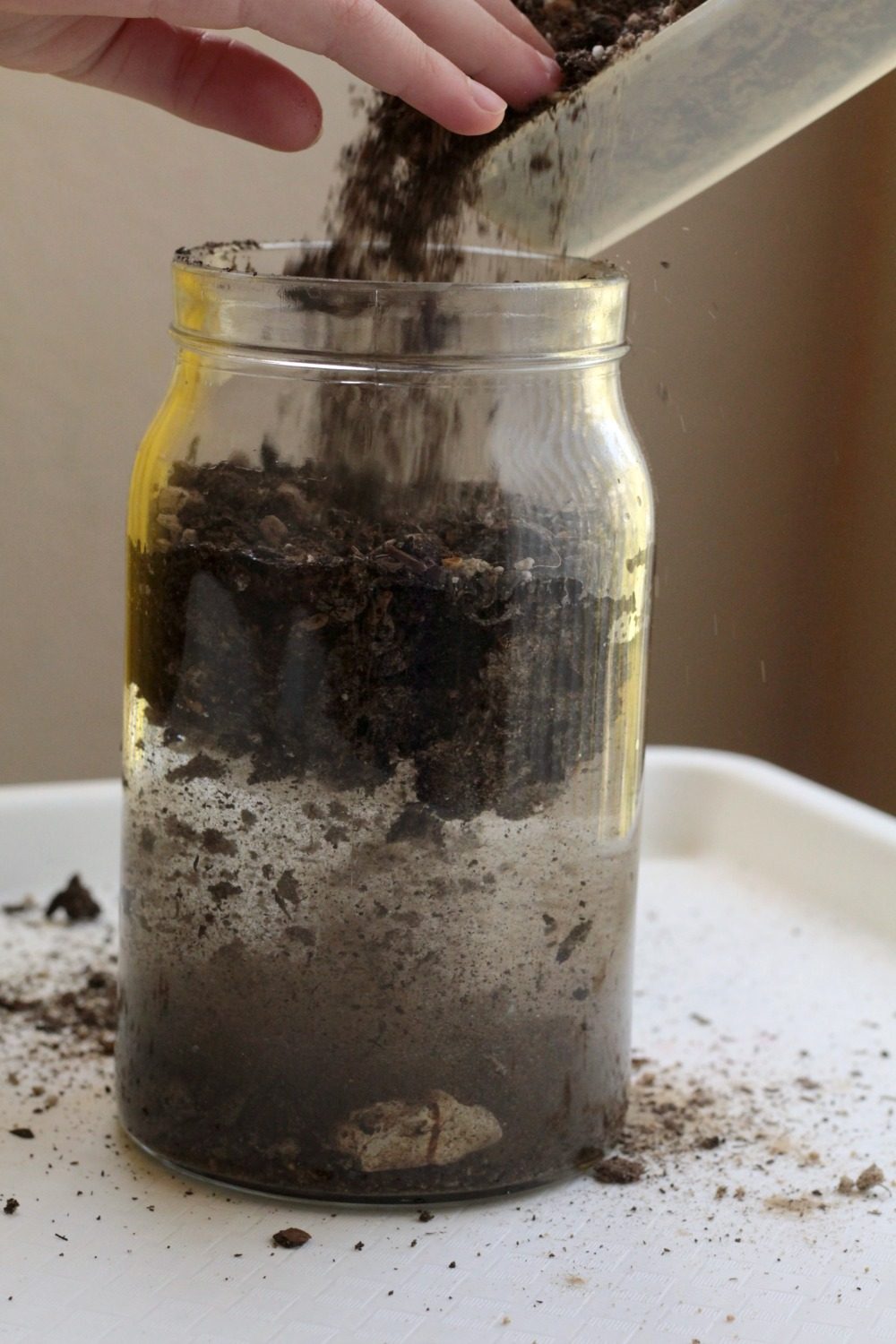 soil layers in a jar