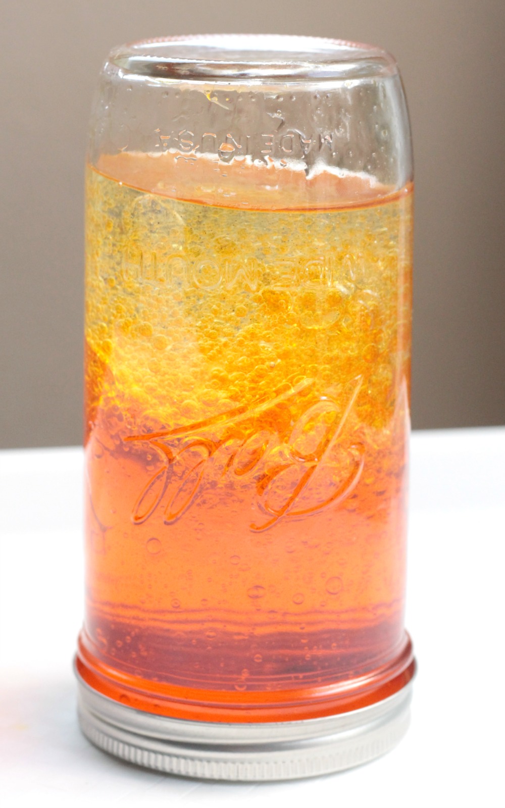 Make your own wave bottle using just oil and water! It's a fun way to explore the science of molecules with young kids interested in science!