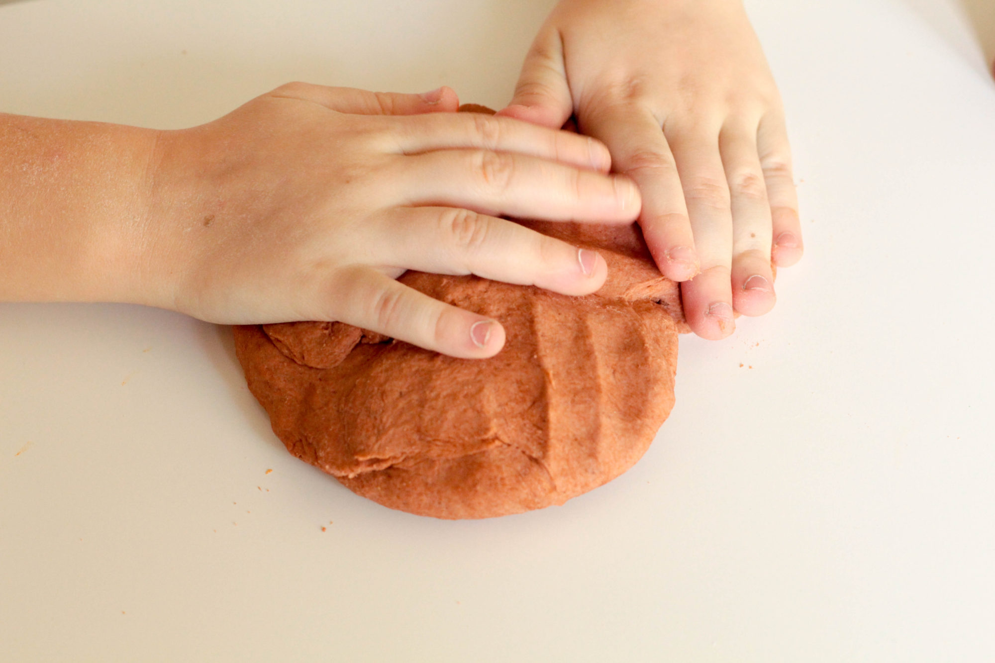 Gingerbread play dough is a fun sensory activity that mixes science and Christmas in a way kids will love! Perfect for Christmas!