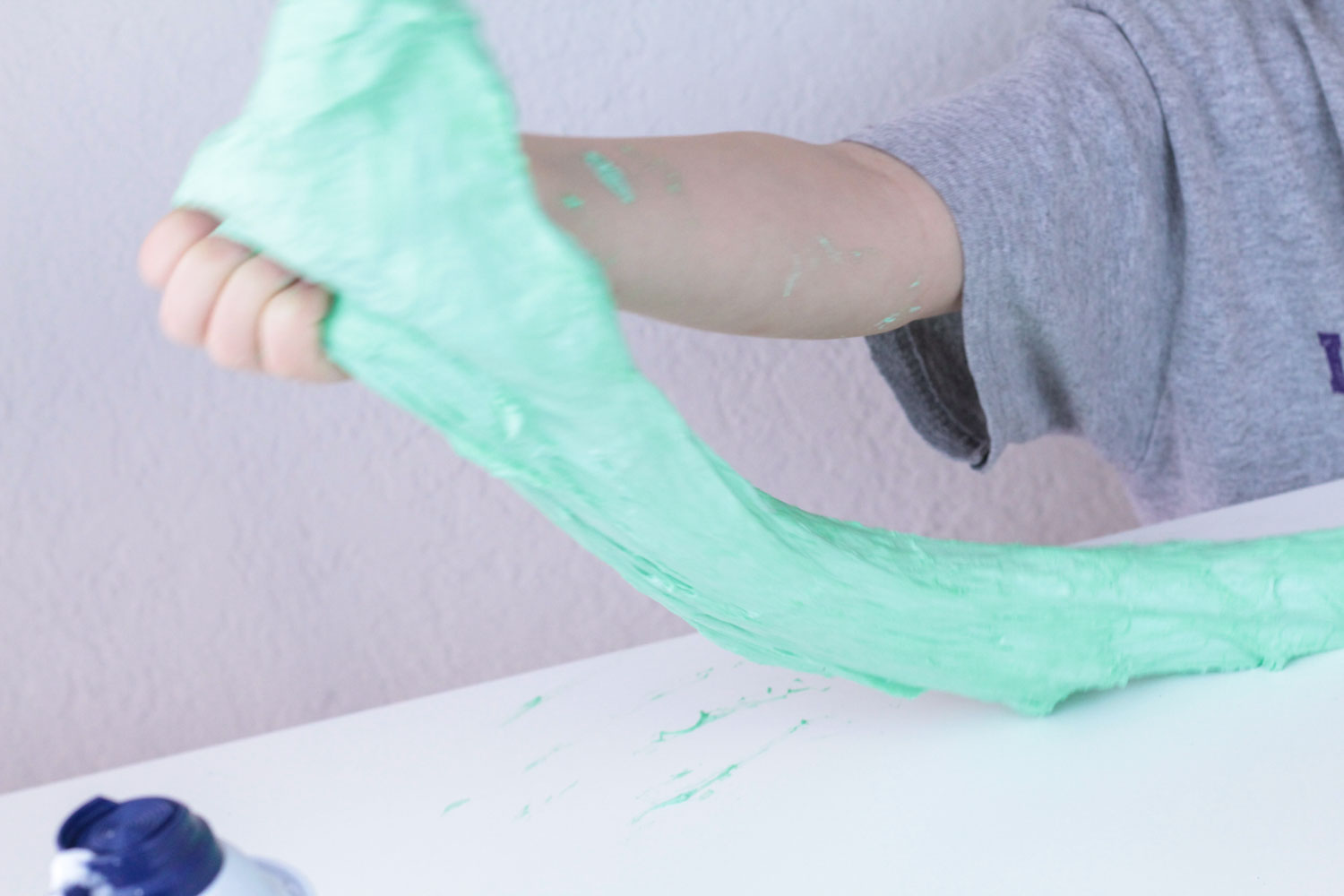 Learn about chemical reactions and polymer chains in this fun activity making perfect fluffy slime! Kids will love this hands-on science activity. 